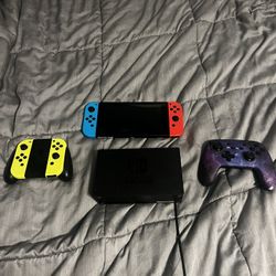 Nintendo Switch with extra controllers and case