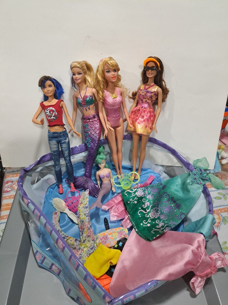 4 Barbies Whet Xtra Clothing  $10.00