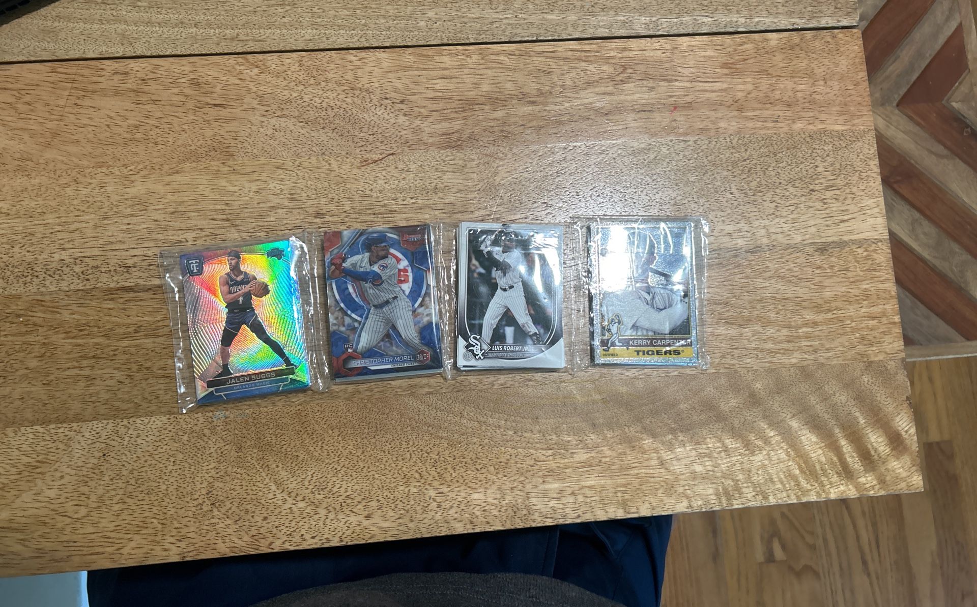 Trading Sports Cards. One Basketball, Three Baseball.