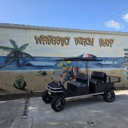 Gas club car transporter with dump bed