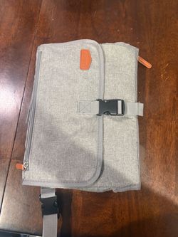 Portable changing pad wipeable