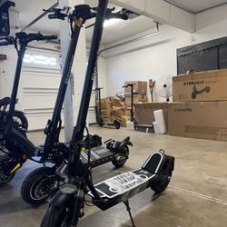 Electric scooter with shock absorber