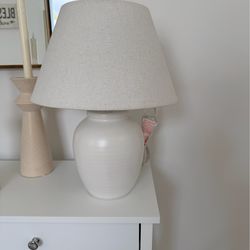 Brand new Beige white table lamp purchased from Hobby lobby . Still has original tag and has never been used.