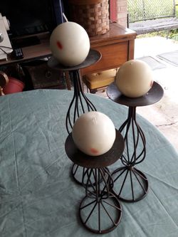 3 candle holder with candle.