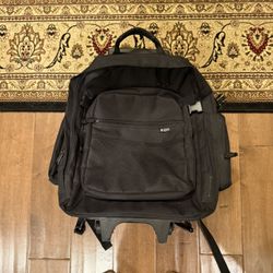 Backpack with wheel and pull handle