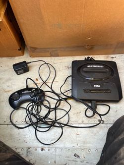 Sega Genesis with controller and wires