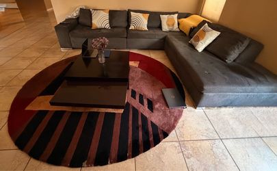 Gray upholdered sectional couch