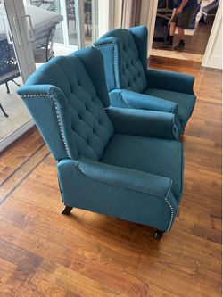 Pair of teal fabric wingback recliner chair features distinct silver nailhead trim detailing along the arms and back - Excellent Condition