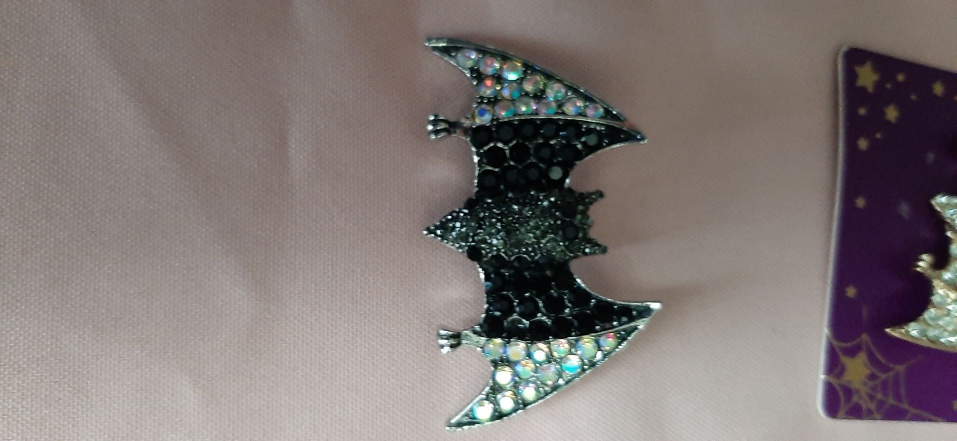 Bat pin/brooch. It's black and silver