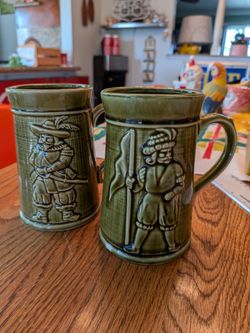 Two vintage MCM Musketeers beer steins, ale cups, beer mugs, tankards, mid century bar ware, breweriana barware pint glass