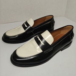 Size 10.5 US Steve Madden Natan Penny Loafers in a black and white leather finish