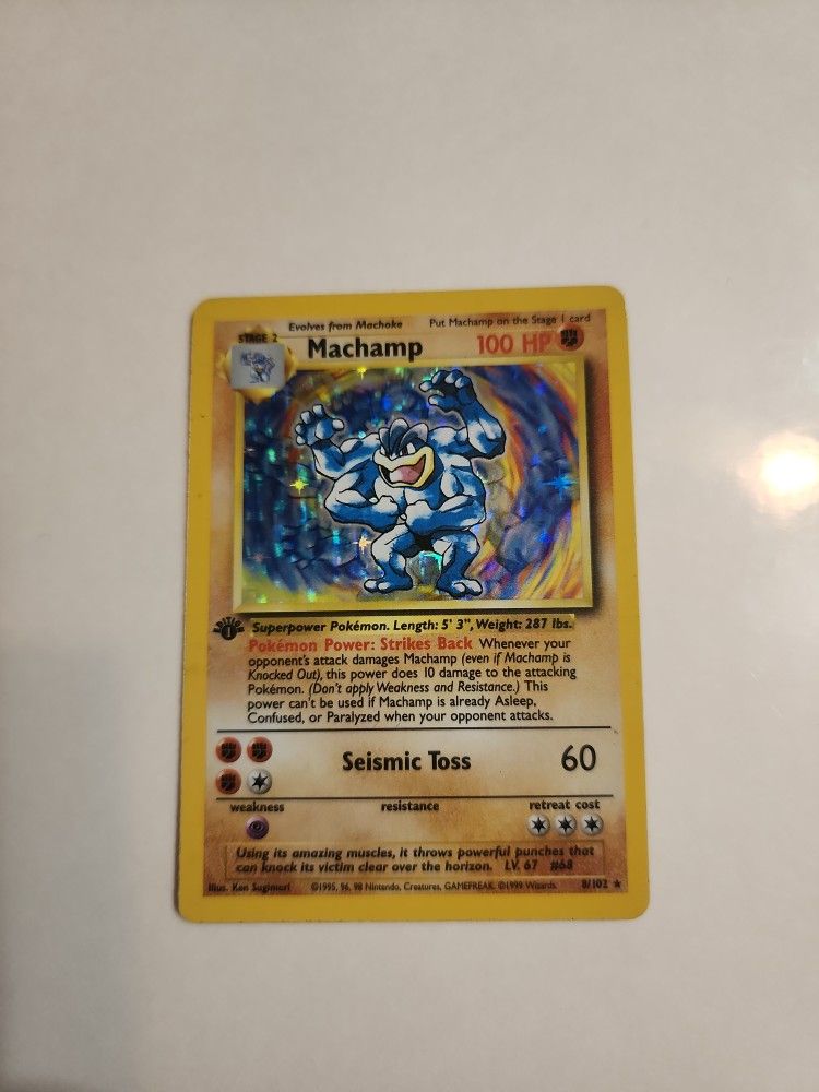 1st Edition Base Set Machamp Pokémon trading card (#8/102).