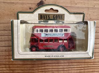 Lledo Days Gone 1932 AEC Regent double-decker bus diecast model. The specific model features "Palmolive" and "General" livery and was made in England