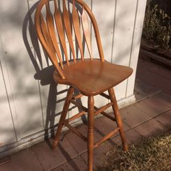Tall Oak swivel stool chair.