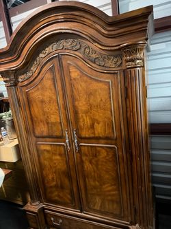 Large Wood Armoire with Carved Details