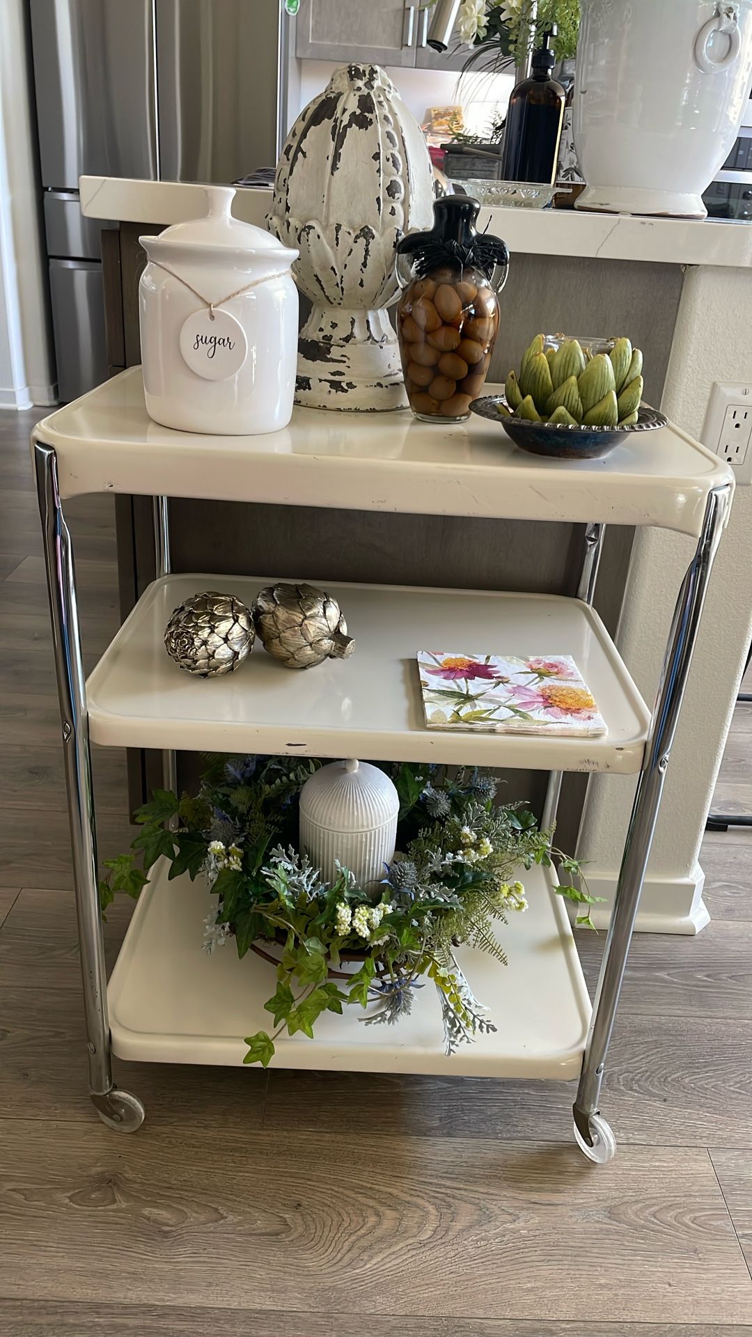 Three tiered vintage cart on wheels