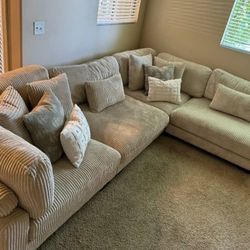 4-piece modular sectional.

Available in black, beige, and gray. Ask for price.