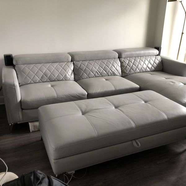 sofia vergara leather sofa  adjustable headrest  ottoman