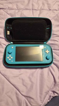 Nintendo Switch Lite Turquoise with Orzly Case and Accessories