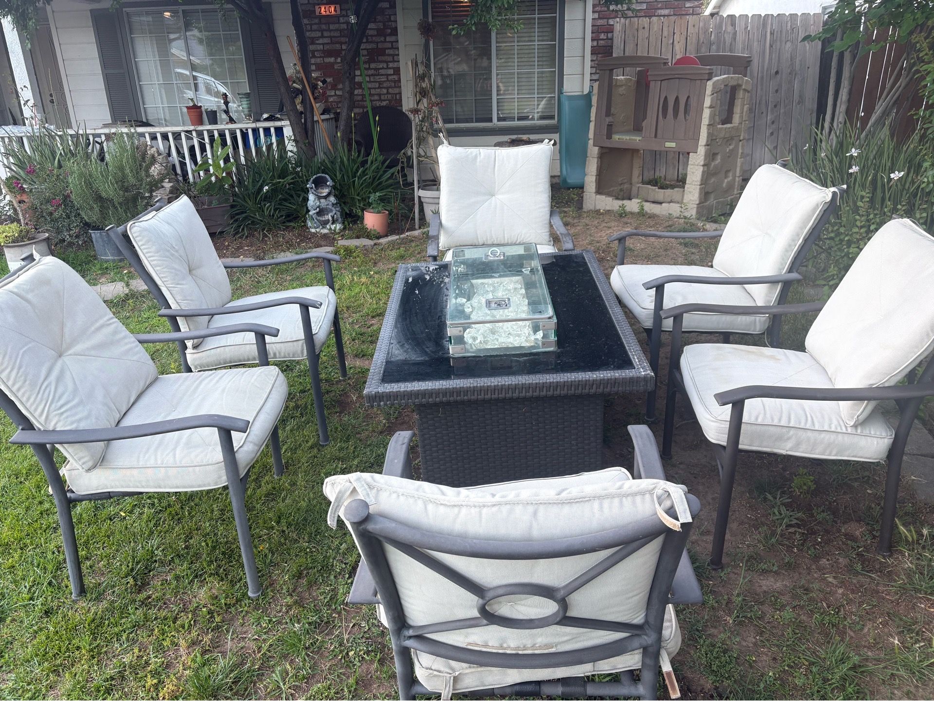 Outland living fire pit table with patio chairs