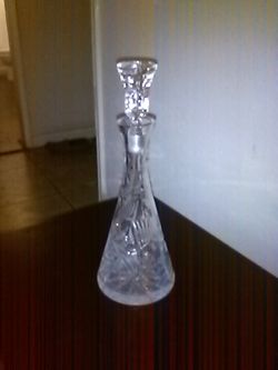 Heavy cut crystal decanter .