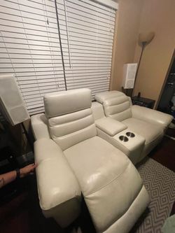 Electric reclining chairs with cup holders and plugs