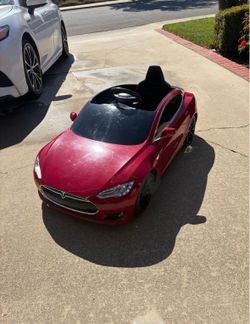 Tesla Radio Flyer battery powered car