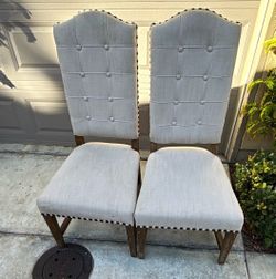 Pair of High Back Upholstered Dining Chairs with Nailhead Trim
