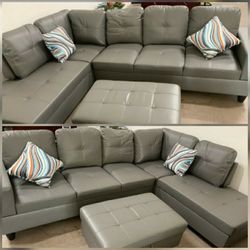 Brand New Gray Leather Sectional With Storage Ottoman 
