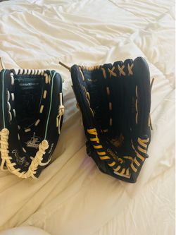 Two  News baseball gloves Rawlingsone is 11 1/2  inch and the other one is 13 inch