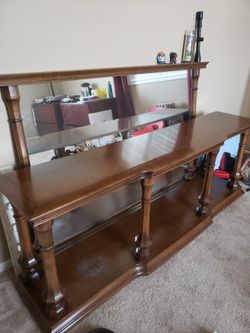 Wooden hallway table with hanging mirror