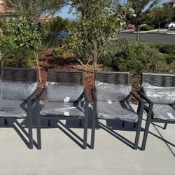 4 iron chairs outdoors