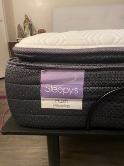 Electric bed with white headboard