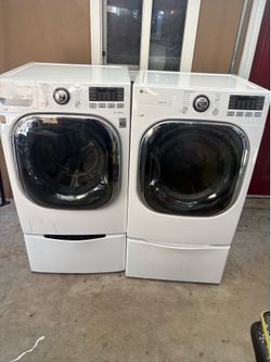 Lg Steam washer with sidekick pedestal washer and gas dryer