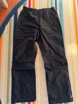 NWOT REI youth L (14/16) waterproof pants.