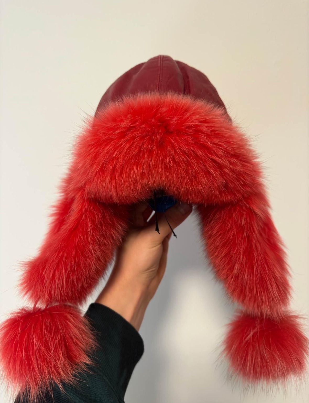 Cap-Ushanka made of natural fur.