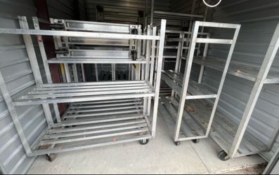 Commercial Aluminum freezer/cooler shelves and Carts shelving without wheels start at $50 with 2 sheves and the ones with wheels start at $150-$200 ea