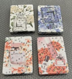 Brand new purse mirror compact.  Perfume bottle motif. 2 mirrors. 1 mirror is a magnifying mirror $8 Ea