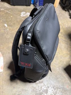 Tumi Black Backpack with Luggage Tag