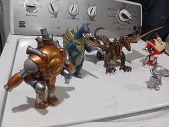 Action figures.  Collectibles.  
1- Small Ghidorah Godzilla Gold dragon. 
2- Mega Blocks Dragon- two headed dragon. 
3- Roblox collection- Dungeon Gol