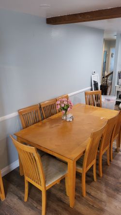 China cabinet and dinner table with 8 chairs.