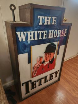 The white horse Tetley Pub sign advertisement