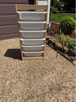 Wooden storage unit with 7 white bins