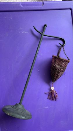 14” tall metal stand. hanging purple candle holder