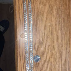 silver figaro chain with jesus pendant 