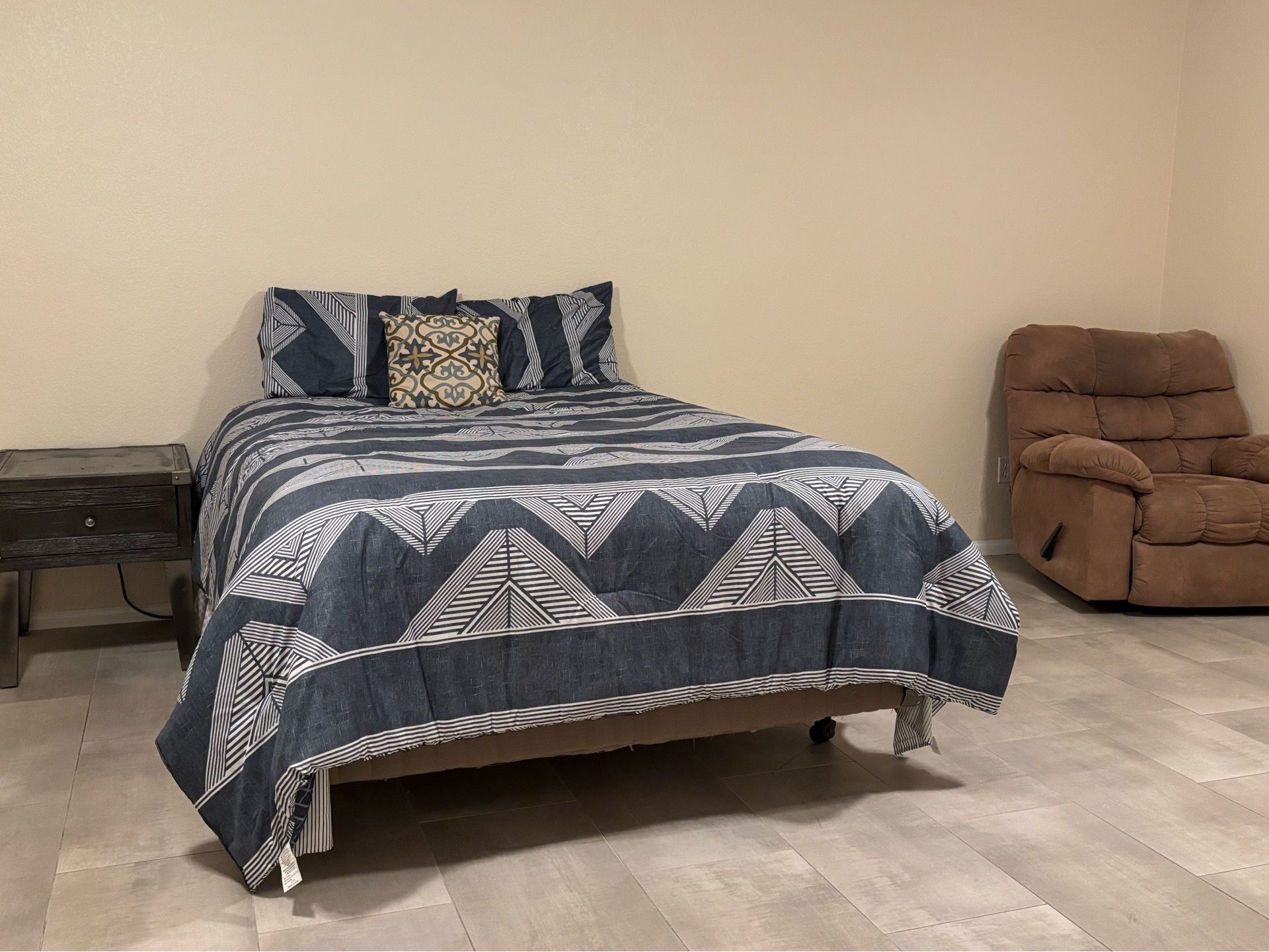Bed, recliner, side table with cable cord
