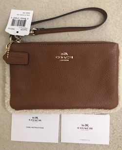 A brand New Coach leather Wristlet