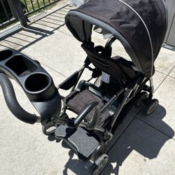 A Graco tandem (front-and-back) stroller