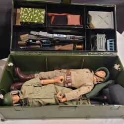 vintage G.I. Joe action figure footlocker set, likely from the 1960s or 1990s, used to store figures and accessories
