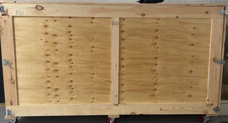 Wooden Crate with Wheels - 105” L x 58” H x 32” W.